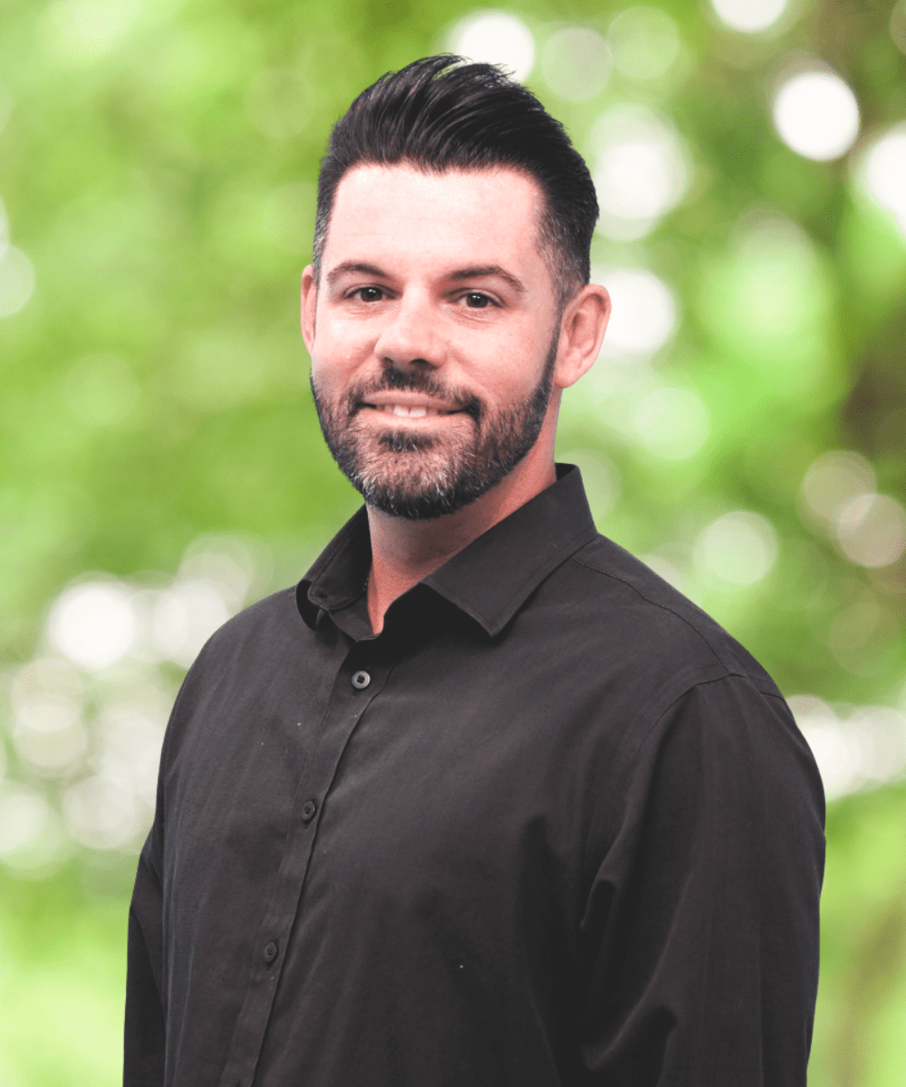 Hand holding keys outdoors